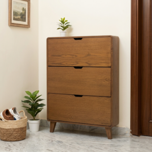 WoodAKH 7-inch deep ultra slim wooden shoe cabinet with 3 tilt-out drawers placed in an entryway corner